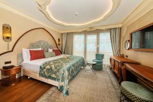 a hotel room with a bed and a piano at Romance Istanbul Hotel Boutique Class in Istanbul +37 photos