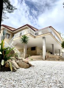 a house with a balcony on top of it at Home Campoamor in Orihuela Costa