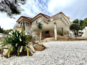 a large house with a balcony on top of it at Home Campoamor in Orihuela Costa