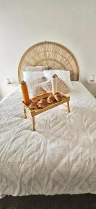 a tray of pastries sitting on a bed at Gîte le temps d'un instant in Samer +22 photos