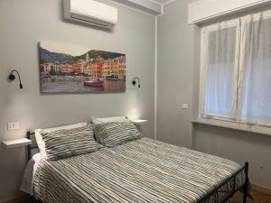 Postel nebo postele na pokoji v ubytování B&B Genova Centrale