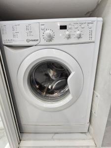 a white washer and dryer in a room at Sharon Apartment in Victoria Beach in Menton