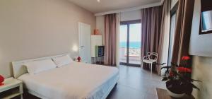 Postel nebo postele na pokoji v ubytování Saracen Sands Hotel & Congress Centre - Palermo