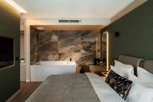 Łóżko lub łóżka w pokoju w obiekcie Le Primore Hotel & Spa