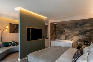 Łóżko lub łóżka w pokoju w obiekcie Le Primore Hotel & Spa