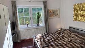 Ein Bett oder Betten in einem Zimmer der Unterkunft Exklusive Ferienwohnungen und Business Apartments Marburg