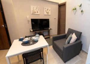 a living room with a couch and a table at Xenia_Apartments A5 in Kozani