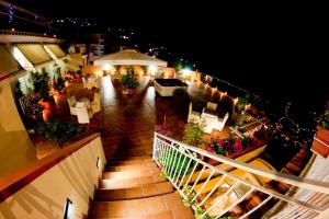 an overhead view of a balcony with tables and chairs at Hotel Bonadies in Ravello