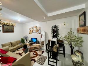 a living room with a couch and a table at Affordable Condominium in Cebu in Cebu City