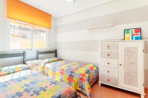 Ένα ή περισσότερα κρεβάτια σε δωμάτιο στο Casa Playa Carabassi +18 φωτογραφίες