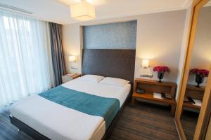 Postel nebo postele na pokoji v ubytování Housez Suites & Apartments Special Class