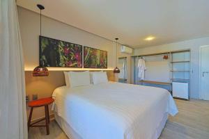 Cama ou camas em um quarto em Pousada Marceneiro