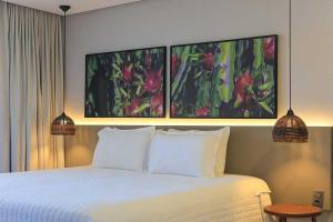 Cama ou camas em um quarto em Pousada Marceneiro