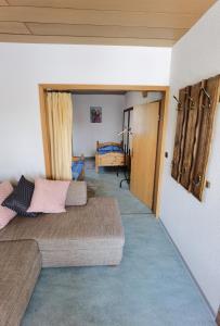 a room with two beds and a door to a bedroom at Ferienwohnung am Backhaus 2 in Weimar +6 photos