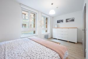 Postel nebo postele na pokoji v ubytování Horní Mísečky - I3 Pohodlný a teplý apartmán u sjezdovky