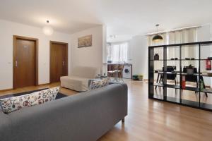 a living room with a couch and a table at São Roque Apartment in São Roque