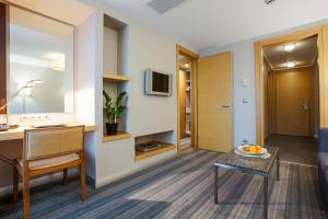 TV a/nebo společenská místnost v ubytování Housez Suites & Apartments Special Class