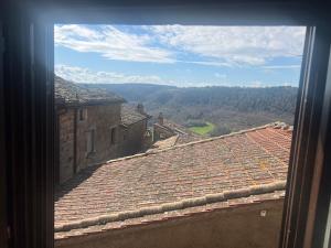 a view from a window of a roof at Le mie origini in Bagnoregio