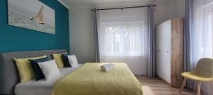 Posteľ alebo postele v izbe v ubytovaní A Bringás Apartman