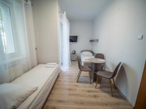 Postel nebo postele na pokoji v ubytování Meduza ośrodek wczasowy