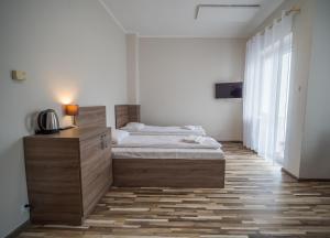 Postel nebo postele na pokoji v ubytování Meduza ośrodek wczasowy