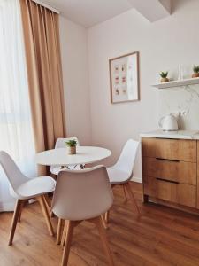 a dining room with a table and chairs at Apartament Gniezno Bulwary 7a in Gniezno