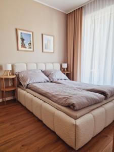 Postel nebo postele na pokoji v ubytování Apartament Gniezno Bulwary 7a