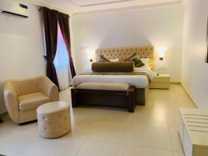 Postel nebo postele na pokoji v ubytování Swiss Pearl Continental Suite