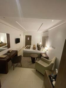Postel nebo postele na pokoji v ubytování Swiss Pearl Continental Suite