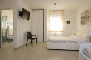 Letto o letti in una camera di Camera & Caffè Cenni