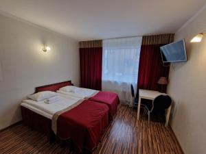 Postel nebo postele na pokoji v ubytování Ecoland Hotel