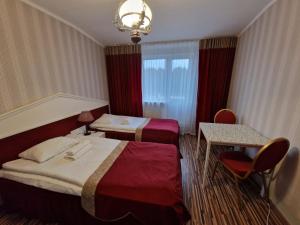 Postel nebo postele na pokoji v ubytování Ecoland Hotel