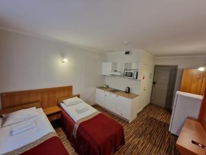 Postel nebo postele na pokoji v ubytování Ecoland Hotel