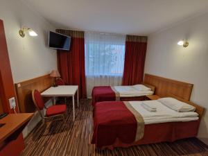 Postel nebo postele na pokoji v ubytování Ecoland Hotel