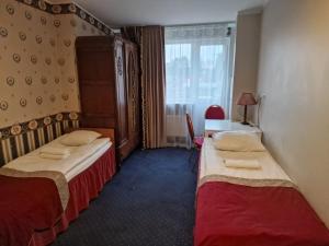 Postel nebo postele na pokoji v ubytování Ecoland Hotel