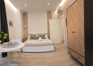 Postel nebo postele na pokoji v ubytování O' Vesuvio B & B