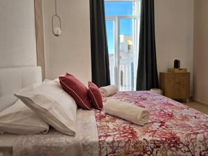 Postel nebo postele na pokoji v ubytování O' Vesuvio B & B
