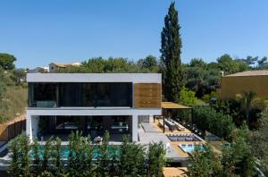 an aerial view of a house with a swimming pool at La Fortuna Villa - Award Winning Luxury Villa Close to Corfu Town in Corfu Town