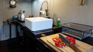 a kitchen counter with a cutting board and a knife at Zeller Kehr Wohnung in Zell an der Mosel +36 photos