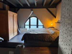 a bedroom with a large bed in a attic at Zeller Kehr Wohnung in Zell an der Mosel