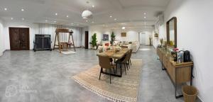 a living room with a table and a couch at Al Damany Desert camp &Villa in Dubai