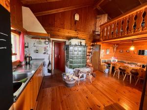 a kitchen with wooden floors and a dining room at Kircher Hütte in Diex