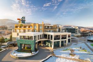 a building with a pool in front of it at Park & Spa Hotel Markovo in Plovdiv