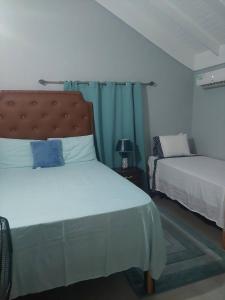 a bedroom with two beds at Royal Palm Luxury Villas in Ocho Rios +33 photos