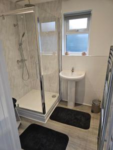 a bathroom with a shower and a sink at Home Away From Home in Blean +19 photos