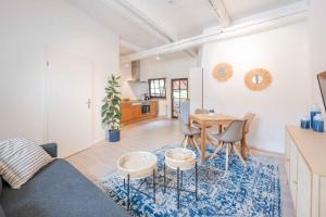 a living room with a couch and a table at FREYZEIT Apartments Speyer in Speyer