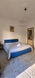 Postel nebo postele na pokoji v ubytování B&B Argentiera 12