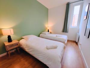 Katil atau katil-katil dalam bilik di Cozy Apartment with View of the Grand Place 6 p