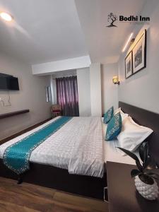 Postel nebo postele na pokoji v ubytování Bodhi Inn Homestay