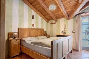 Postel nebo postele na pokoji v ubytování Agriturismo Alpenvidehof